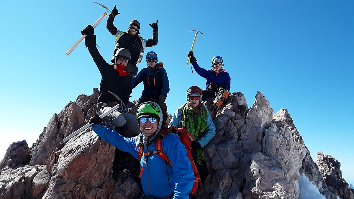 teenagers hiking and climbing mt shasta in california