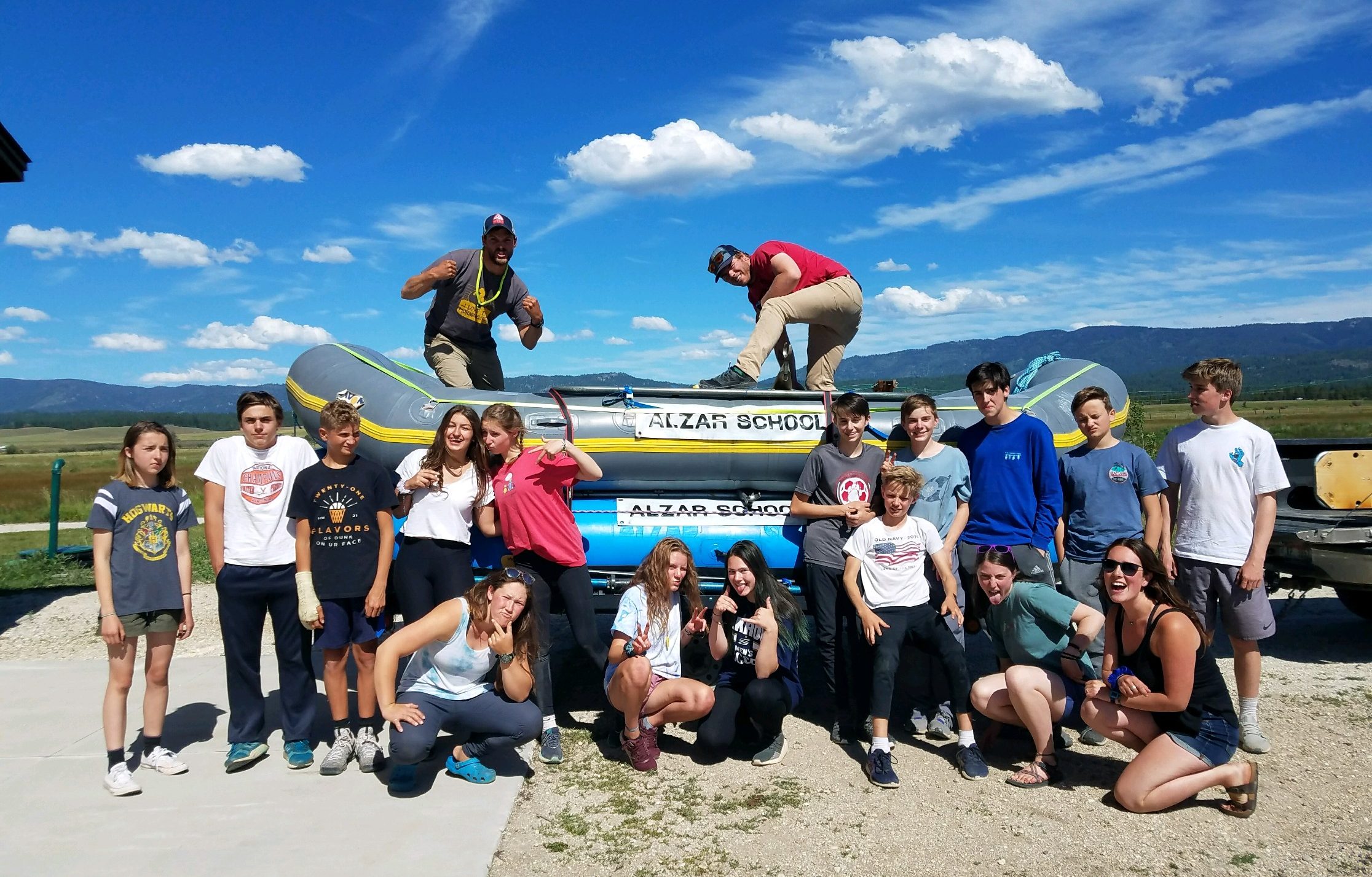 teenagers standing near whitewater raft idaho