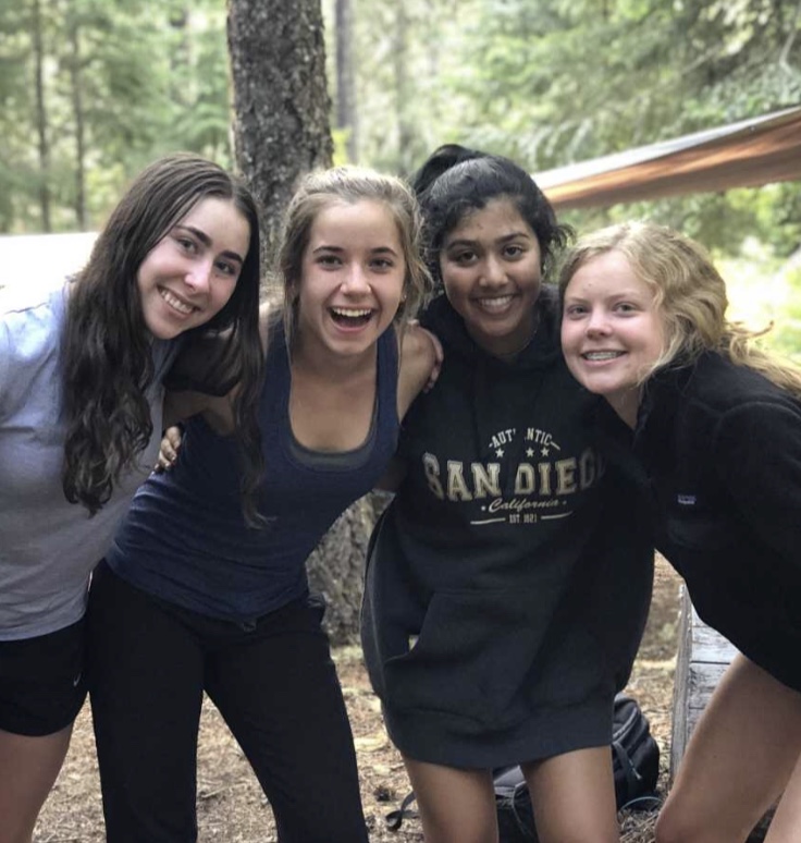 teenage girls standing together and smiling