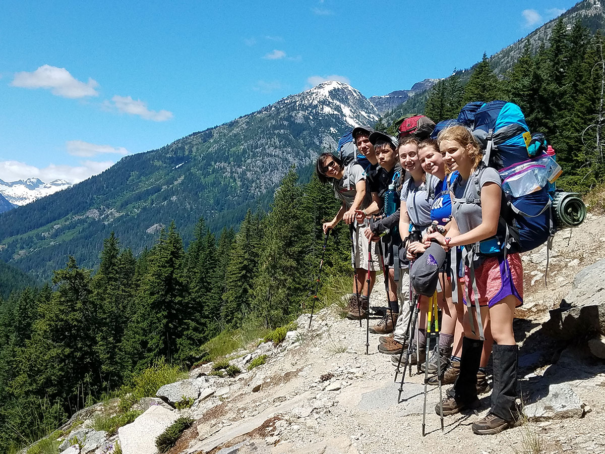 teenagers backpacking and hiking in goat rocks wilderness washington