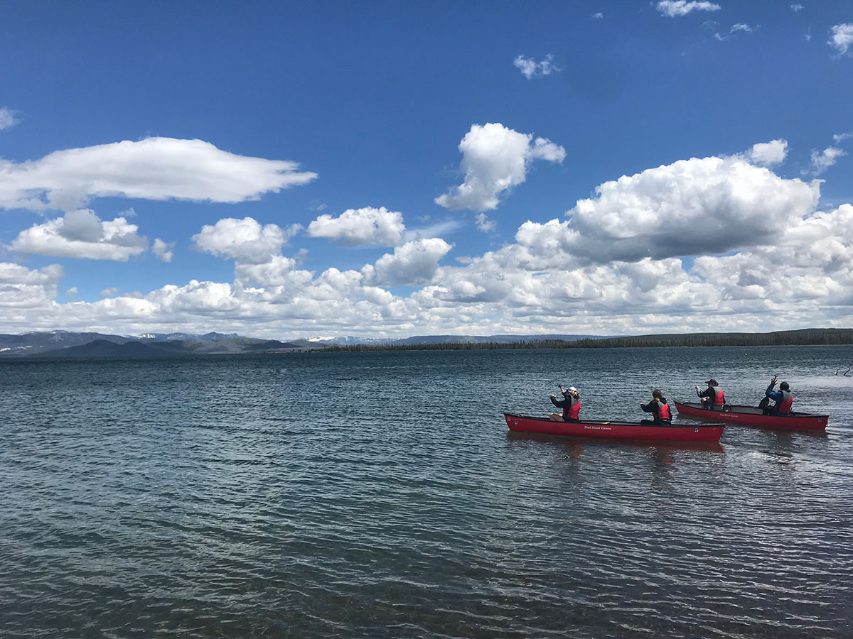 teenagers canoeing on yellowstone lake wyoming